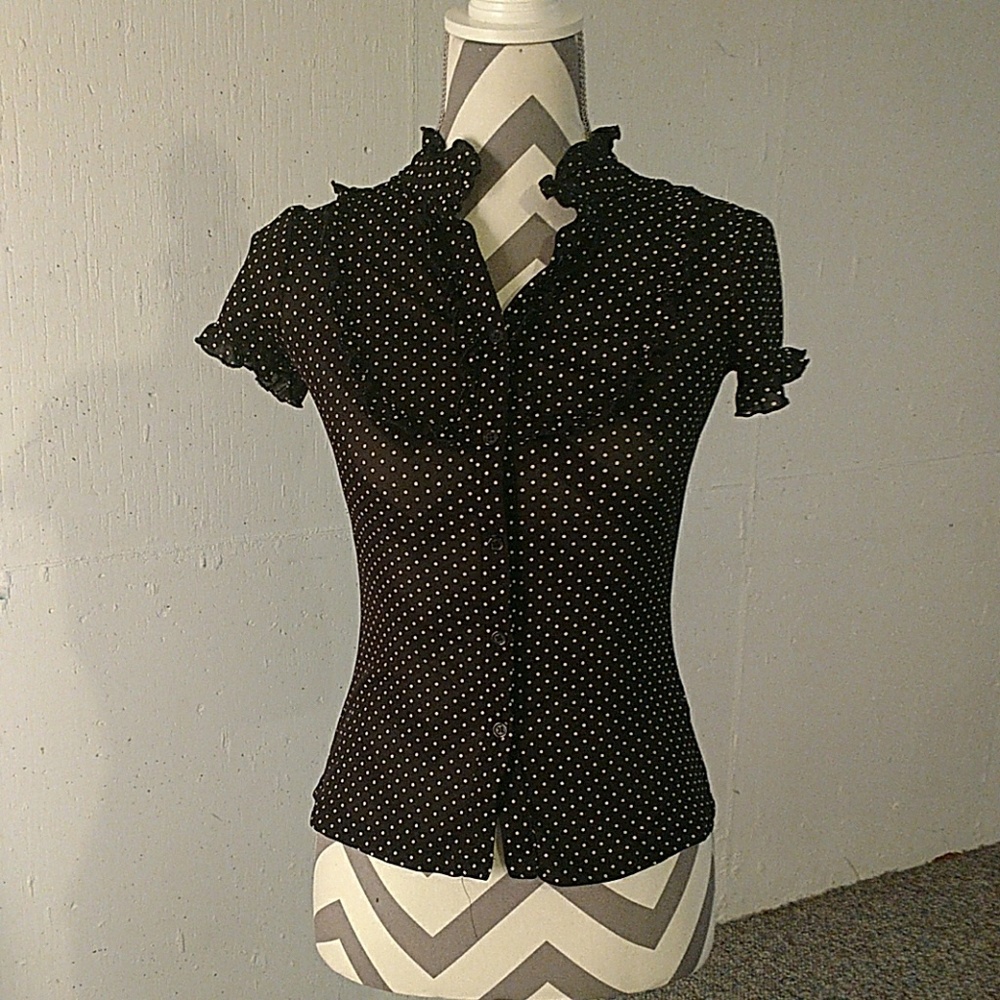 Black and white ruffled button up.